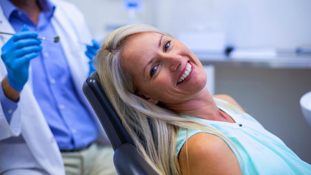 drLarhs_Advanced_Dentistry_At_Century_Square_Seattle_smiling_female_blonde_hair_bright_White_Teeth