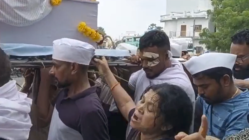 Air India crash survivor among mourners in a funeral procession.