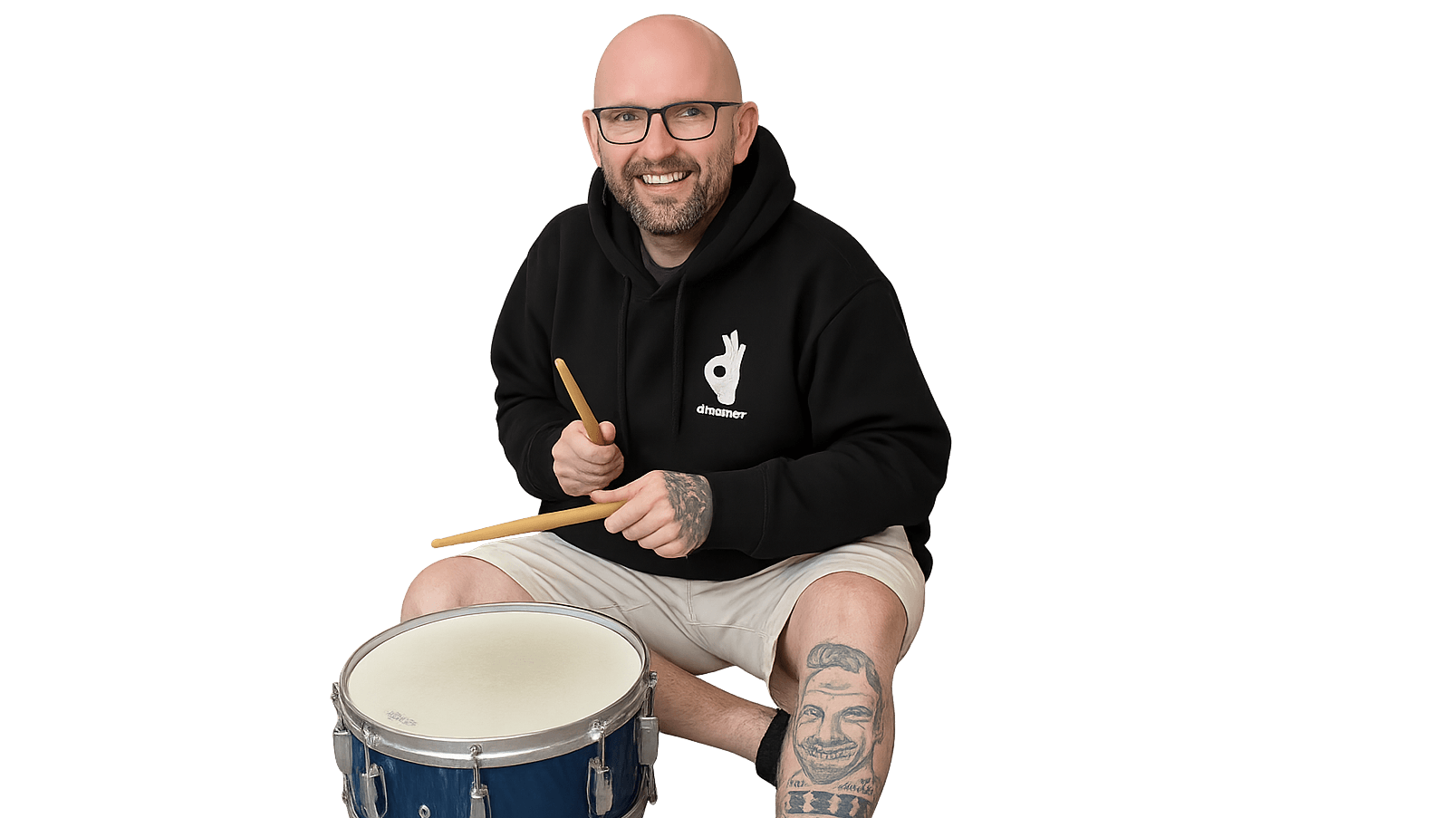 Lee Jobber enjoying a moment playing the drum in casual setting.