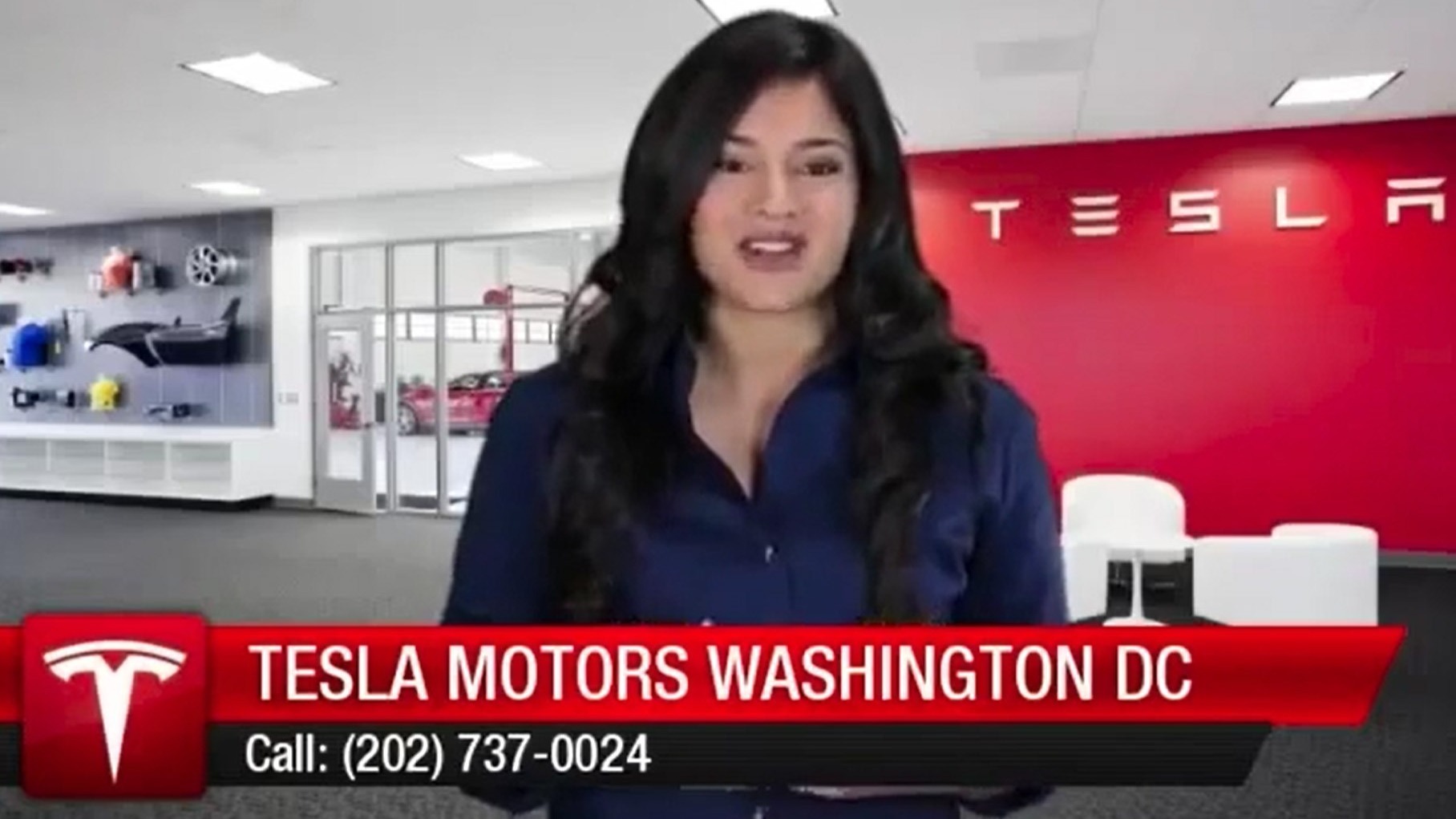 Female spokesmodel reporting from Tesla location