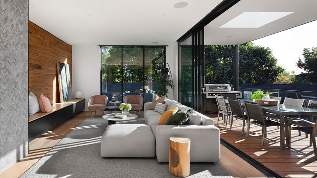 view from family room out to terrace through open sliding glass patio doors gvs design and build construction