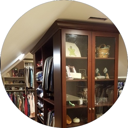 Master closet - Mahogany color master closet over a garage