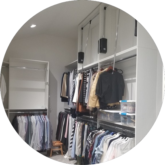 custom closets - whute custom closets with pull down 3rd level