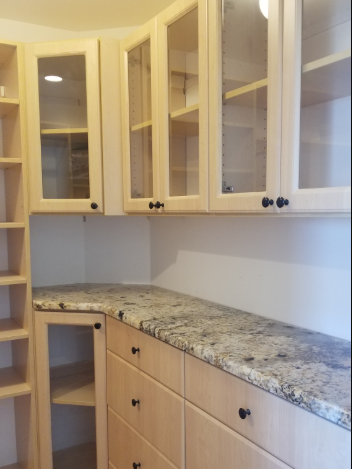 Maple custom closet with glass doors