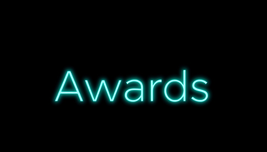 Awards text in glowing turquoise on black background