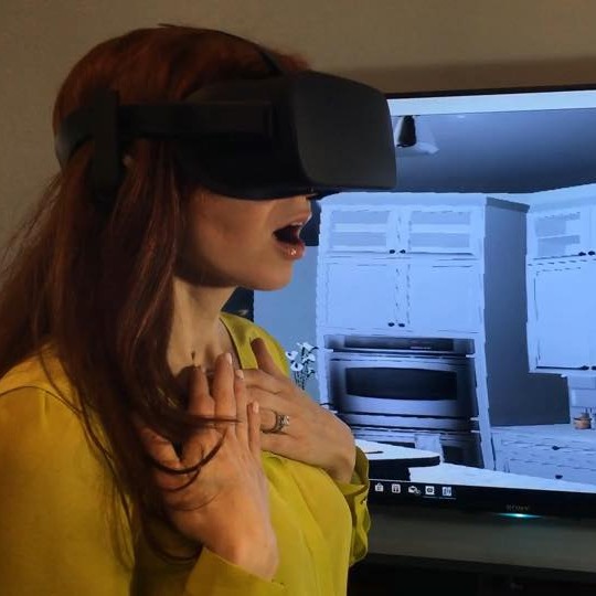 Person watching kitchen designer in 3D