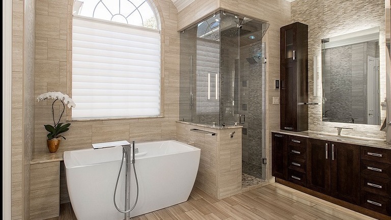 modern bathroom with tub, shower and vanity