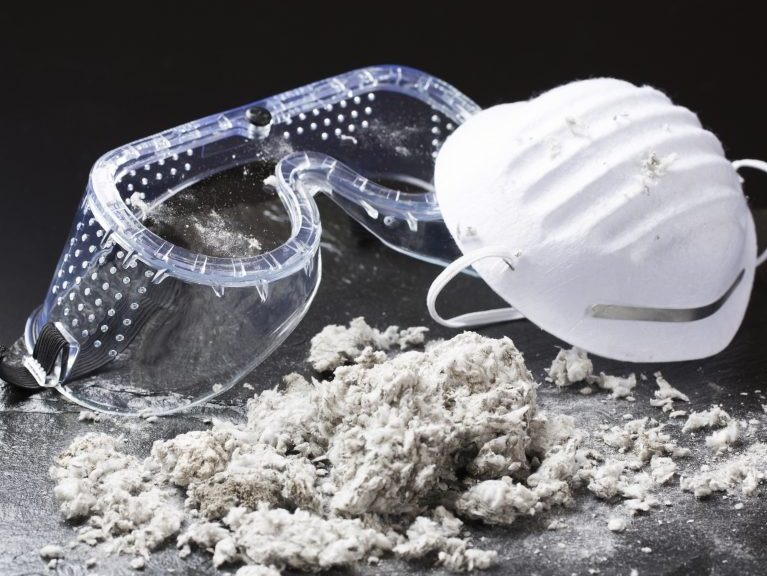 Safety goggles, mask and asbestos particles