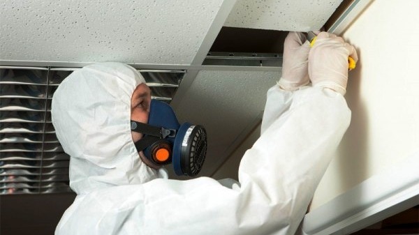 man testing for asbestos
