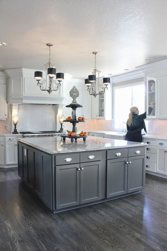 white kitchen cabinets with a wood island