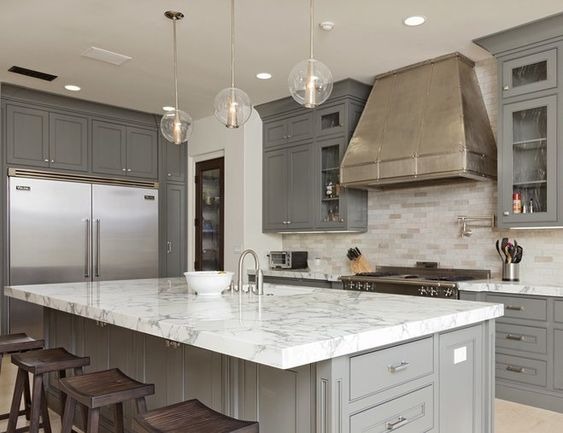 modern kitchen with island and white cabinets and dark wood floor