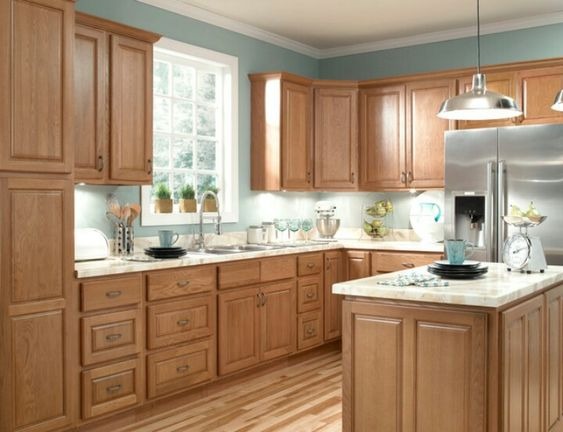 modern kitchen with island and white cabinets and dark wood floor
