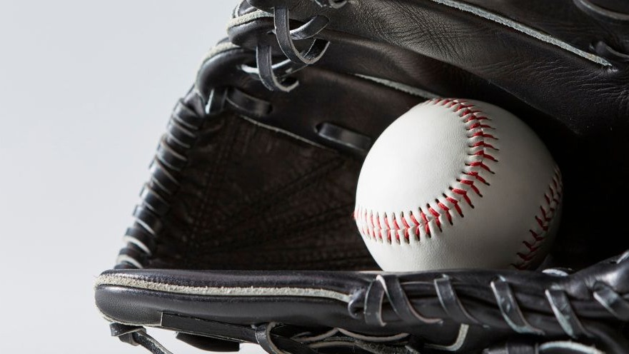 Baseball athlete ready to throw ball on field, dynamic action shot.