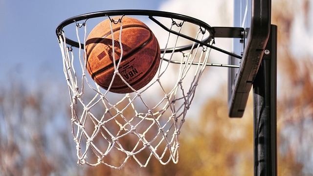Photorealistic shot college basketball action.