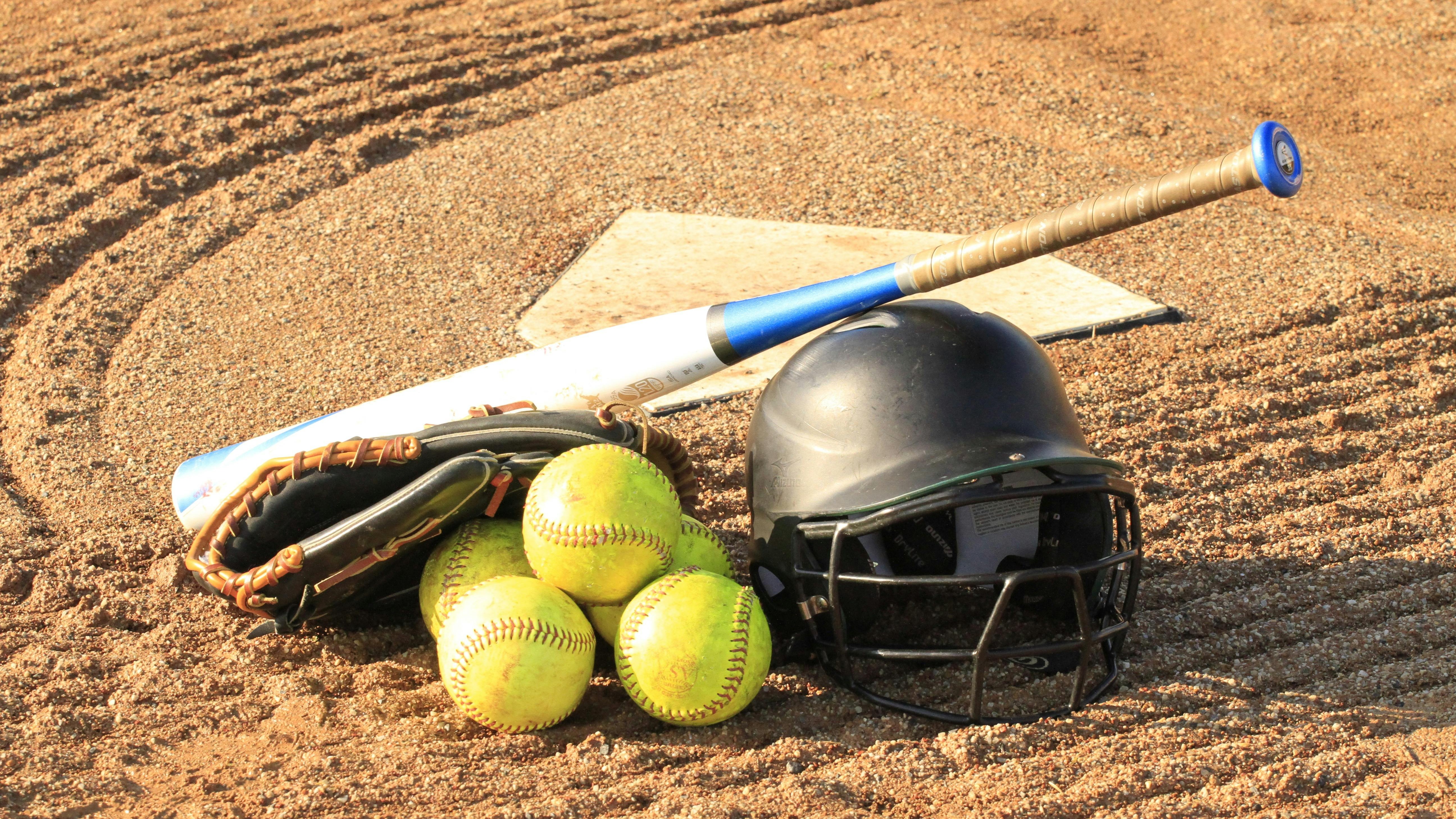 Arkansas softball player at NCAA Super Regional, field background.