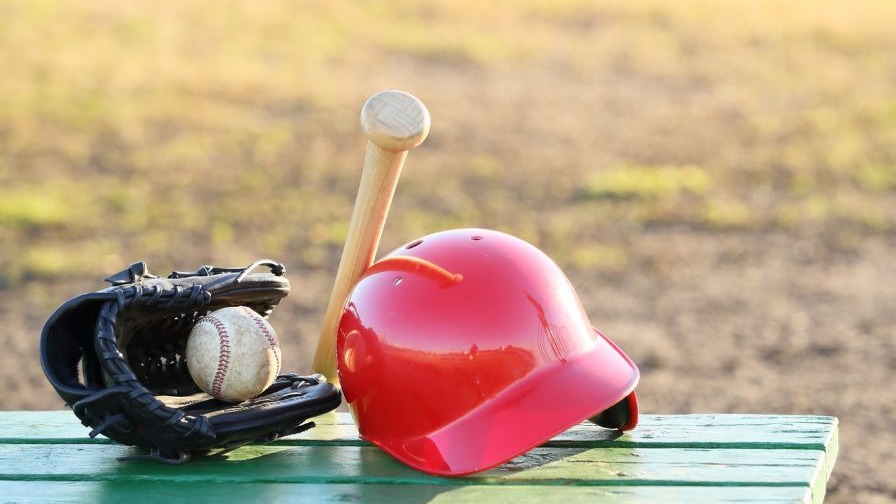 Arkansas Razorbacks Baseball player practicing on field.