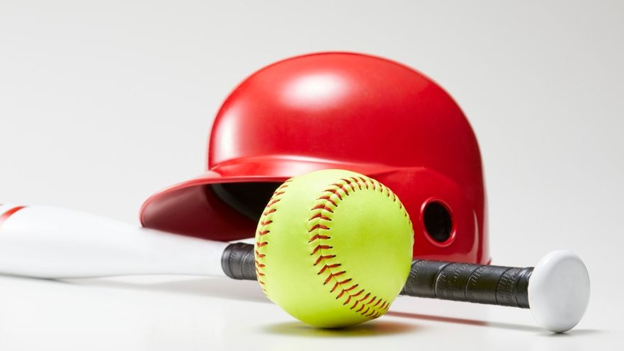 Close-up of a softball on grass at 2025 SEC Softball Tournament.