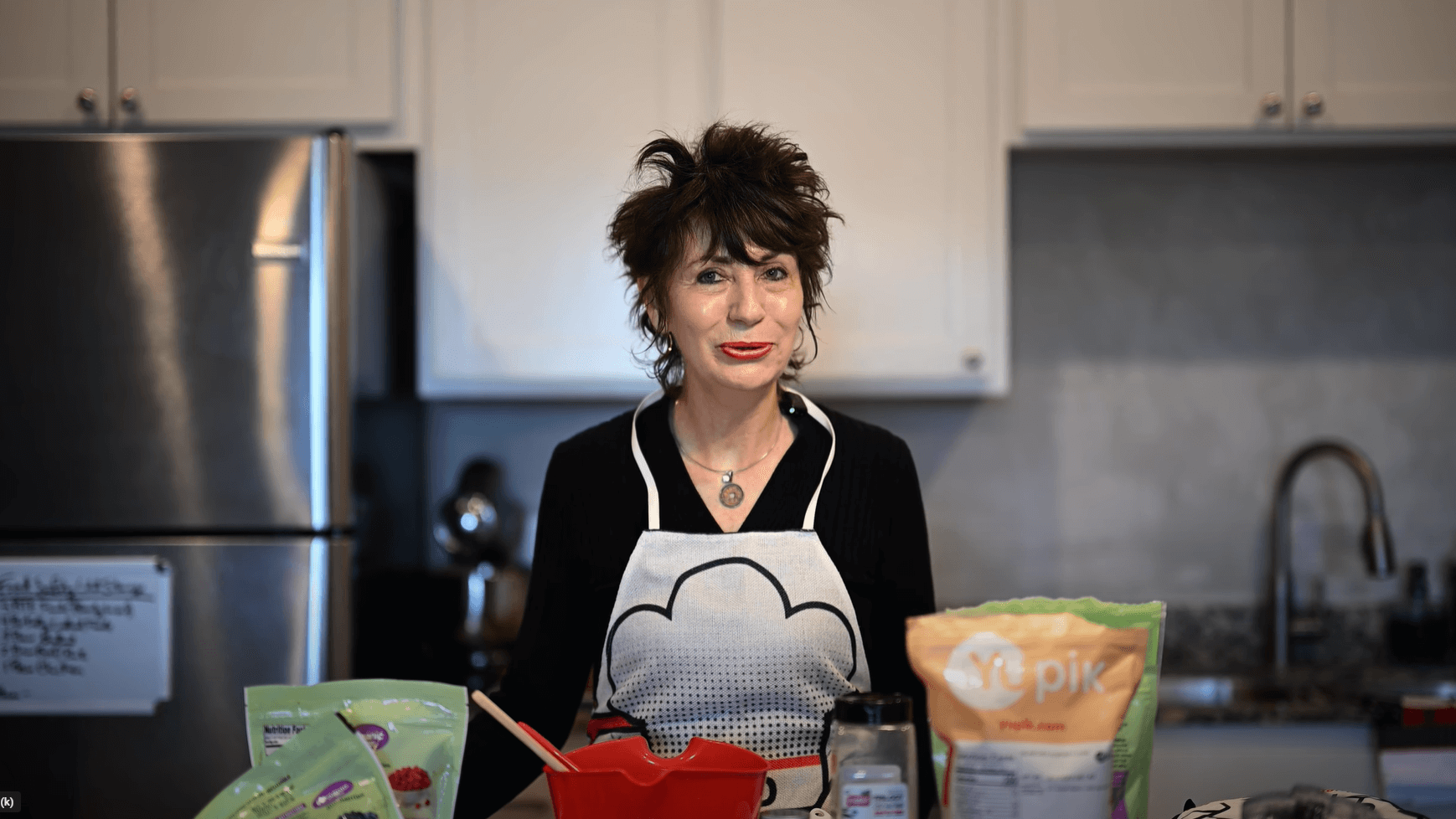 Woman preparing easy microwave beverages in a modern kitchen.