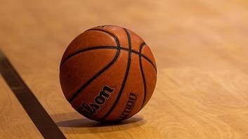 Basketball player in action during a game, shot focused.