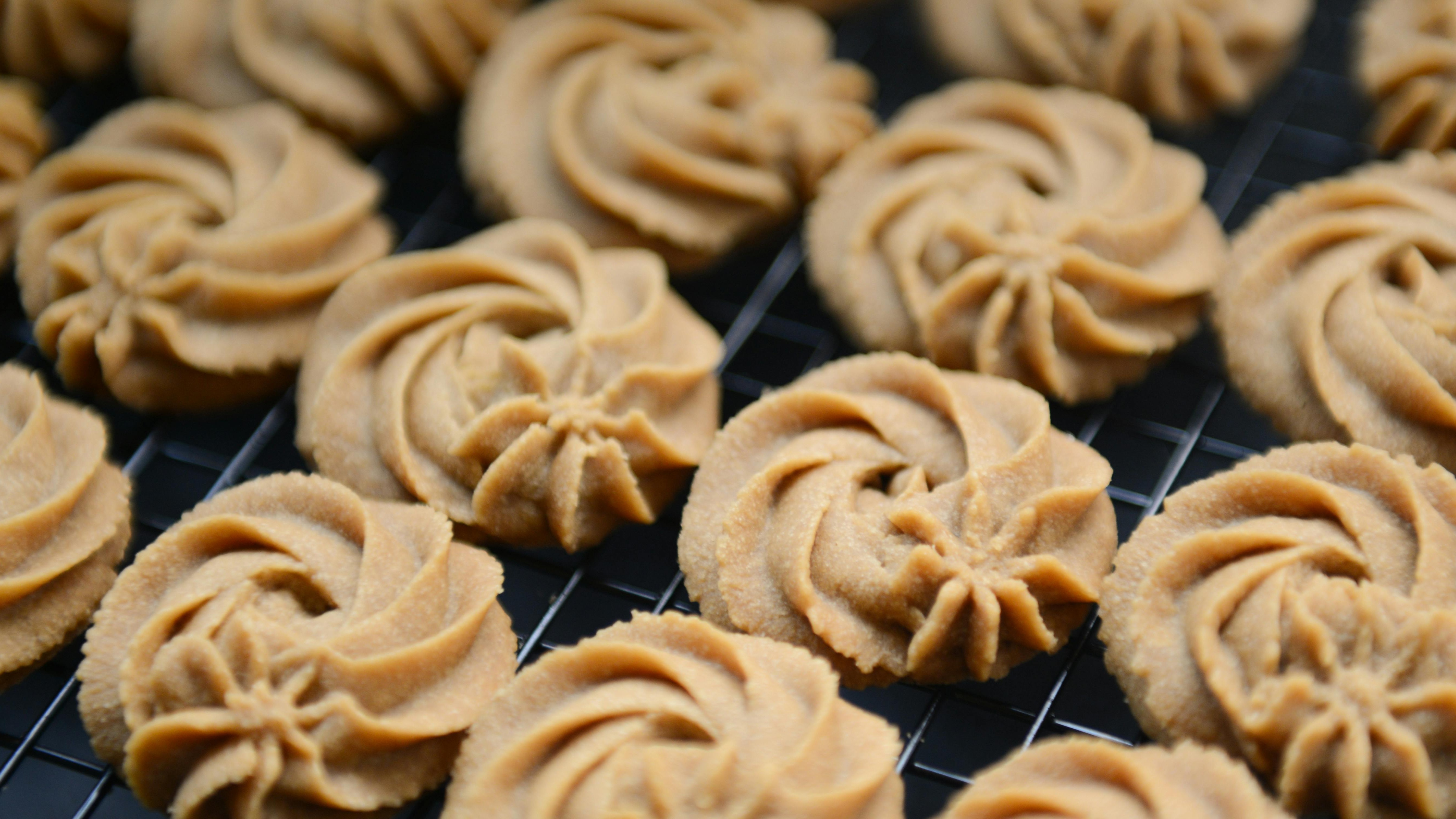 Woman preparing ingredients for best homemade cookies in a modern kitchen.