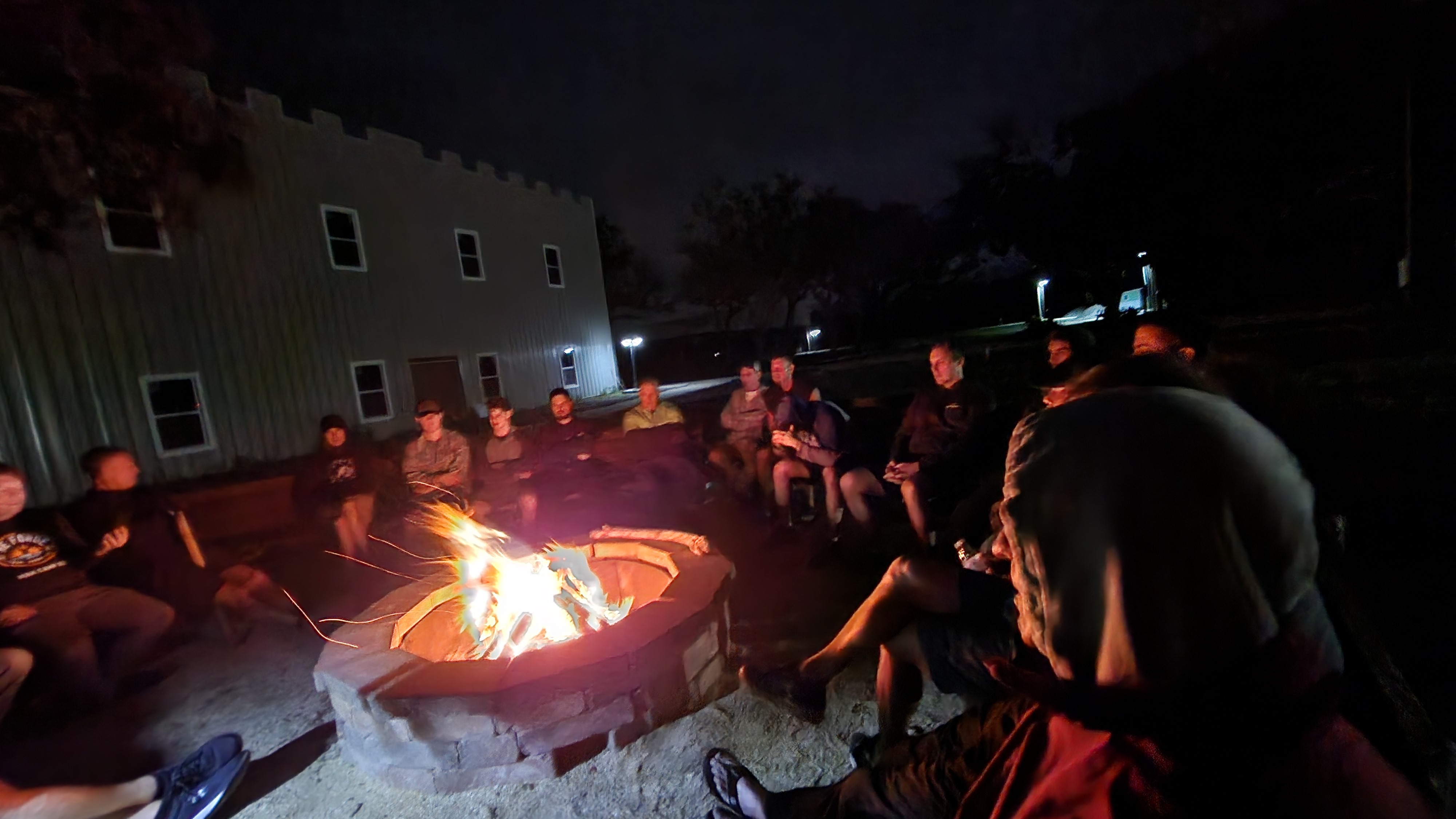 Inviting central florida christian camp rental entrance with guests arriving beneath lush oak and pine trees, welcoming and peaceful atmosphere, crisp morning lighting