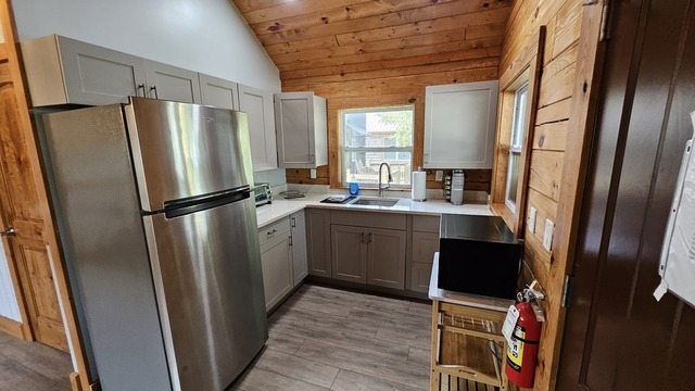 Modern air-conditioned camp cabin interior at christian camp, cozy and inviting florida christian camp rental, highly detailed, bright and comfortable