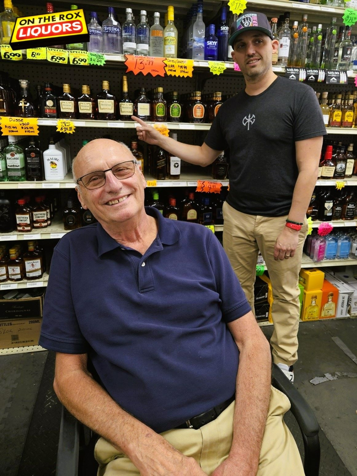 Friendly checkout at Amherst NY liquor store with staff and customer
