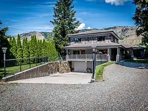 Waterfront home for sale underground driveway