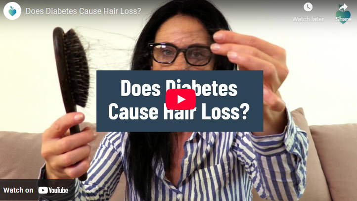 Does Diabetes Cause Hair Loss: Concerned person with hairbrush indoors.