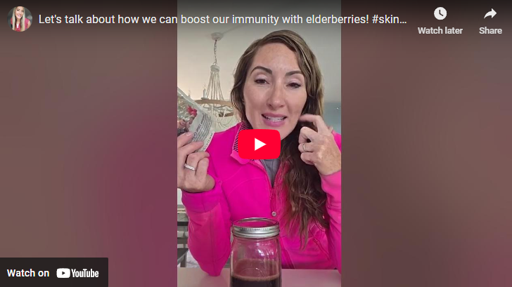 Boost your immune system with elderberry syrup, woman in kitchen.