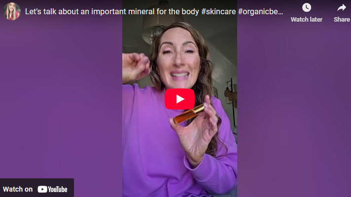 Enthusiastic woman with essential oil promoting frankincense resin extracted oil benefits indoors.