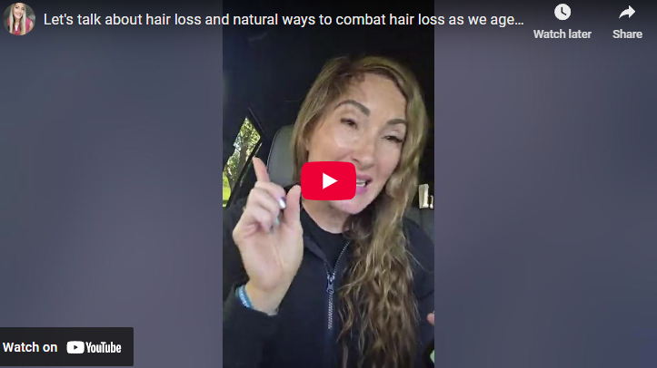 Woman discussing natural ways to combat hair loss as we age, speaking in a car.