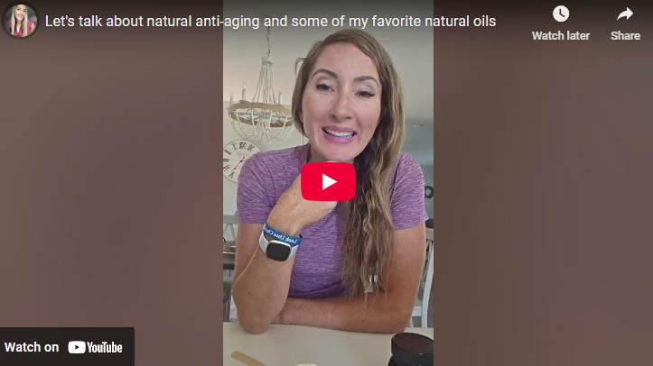 Smiling woman discussing Manuka honey benefits indoors.