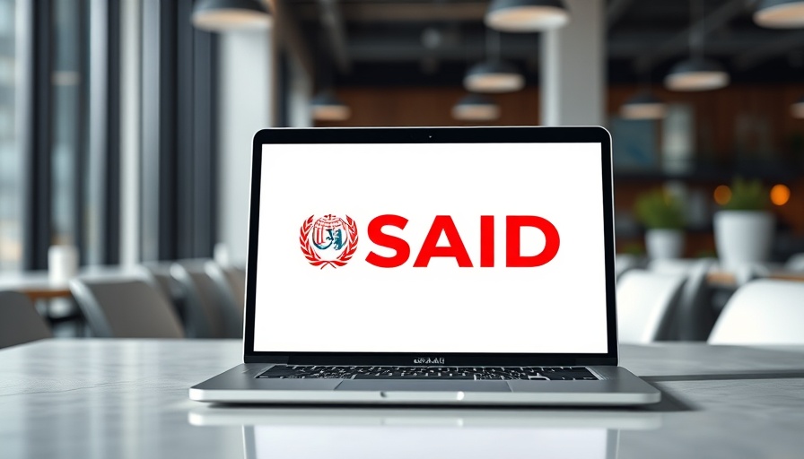 USAID logo on laptop screen in modern office