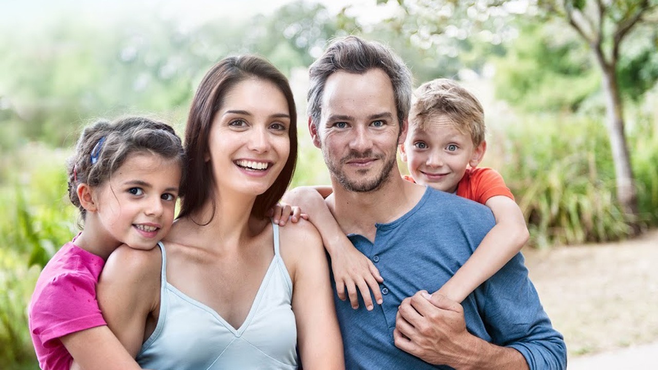 young family posing for photo