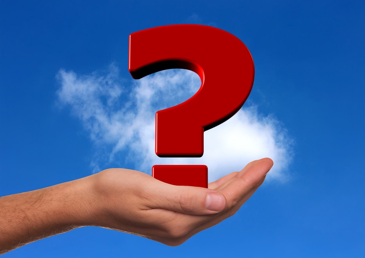 red question mark in hand