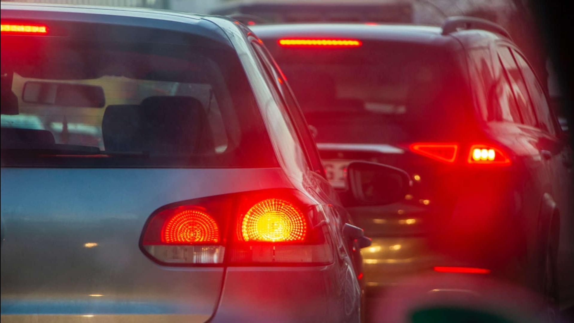 view of two cars with brake lights on