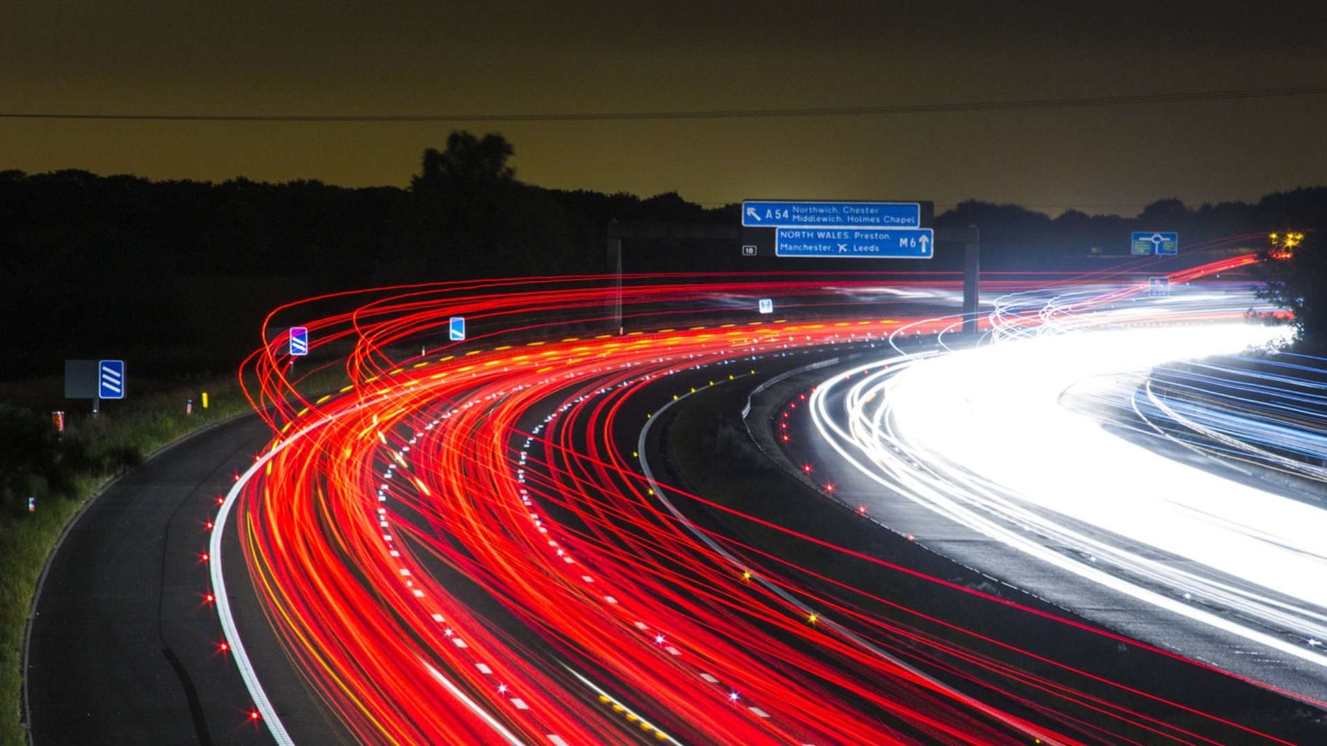 time lapsed photo of highway and lights on cars