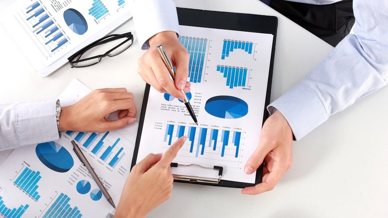 marketing pros discussing graphs and charts