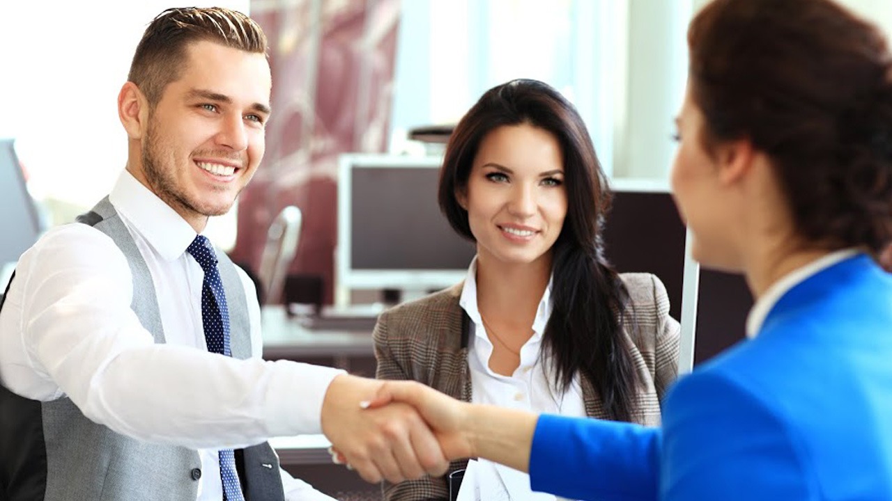 professional male and female shaking hands