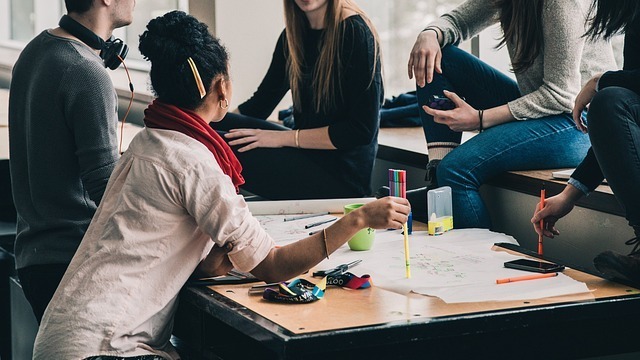 vibrant digital marketing hub, excited group, refining strategies, photorealistic, vibrant wall colors and dynamic furniture, highly detailed, interactive planning session, 8k resolution, diverse color palette, studio lighting, shot with a telephoto lens.