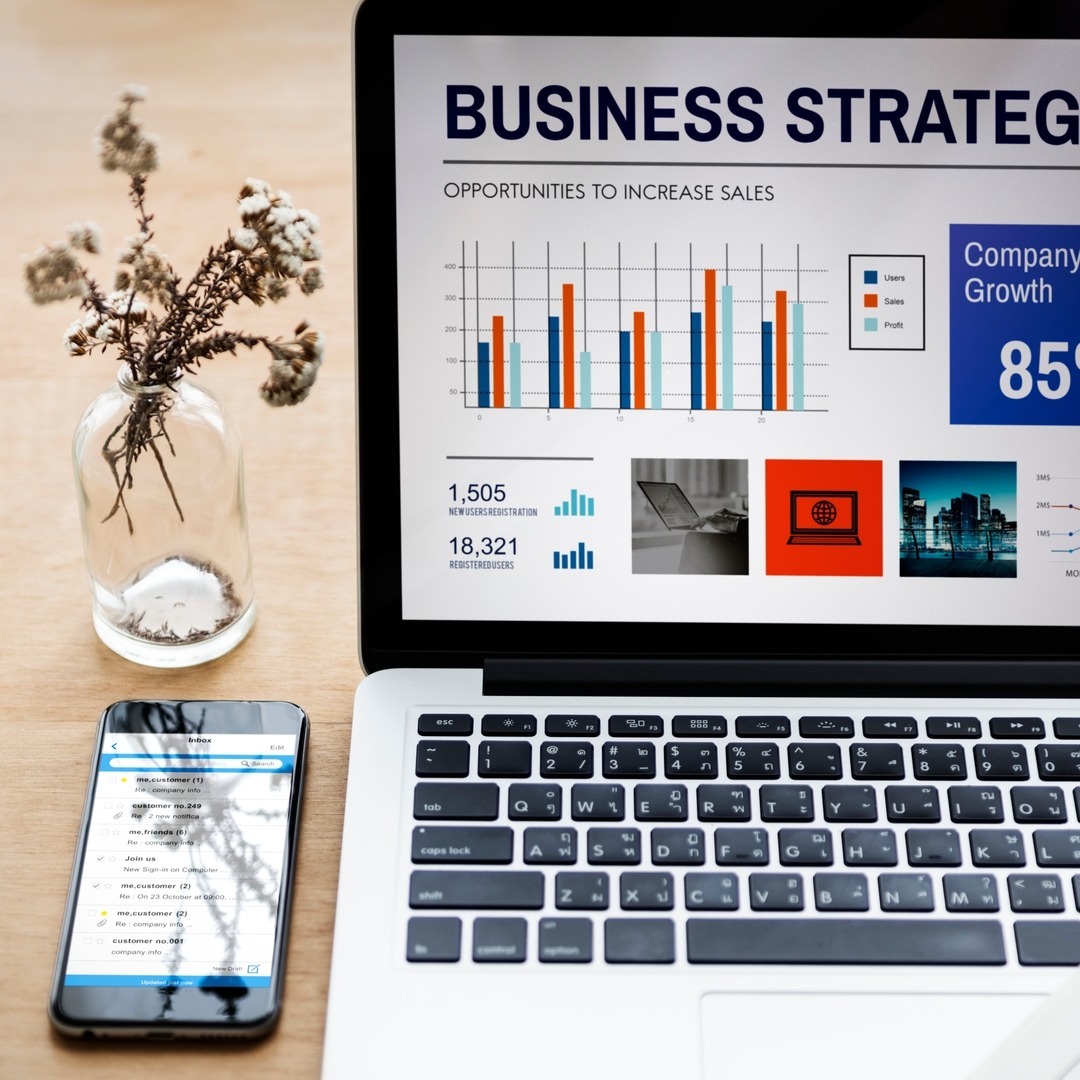 visionary news innovator, enthusiastic, planning new digital strategies, photorealistic, modern office with touch screens and charts, highly detailed, quick typing heard, 50mm lens, sleek modern tones, bright white lighting, shot with a 24-105mm camera lens.