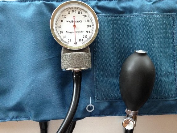 Close-up of an analog blood pressure gauge displaying readings.