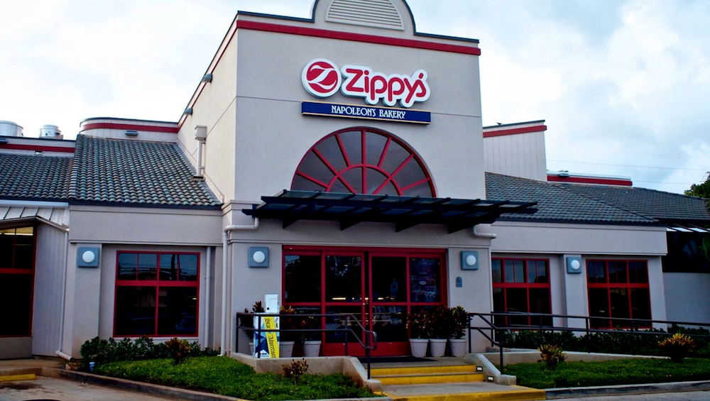 Vibrant comfort food scene at Zippy's Waiau with friends sharing joy.