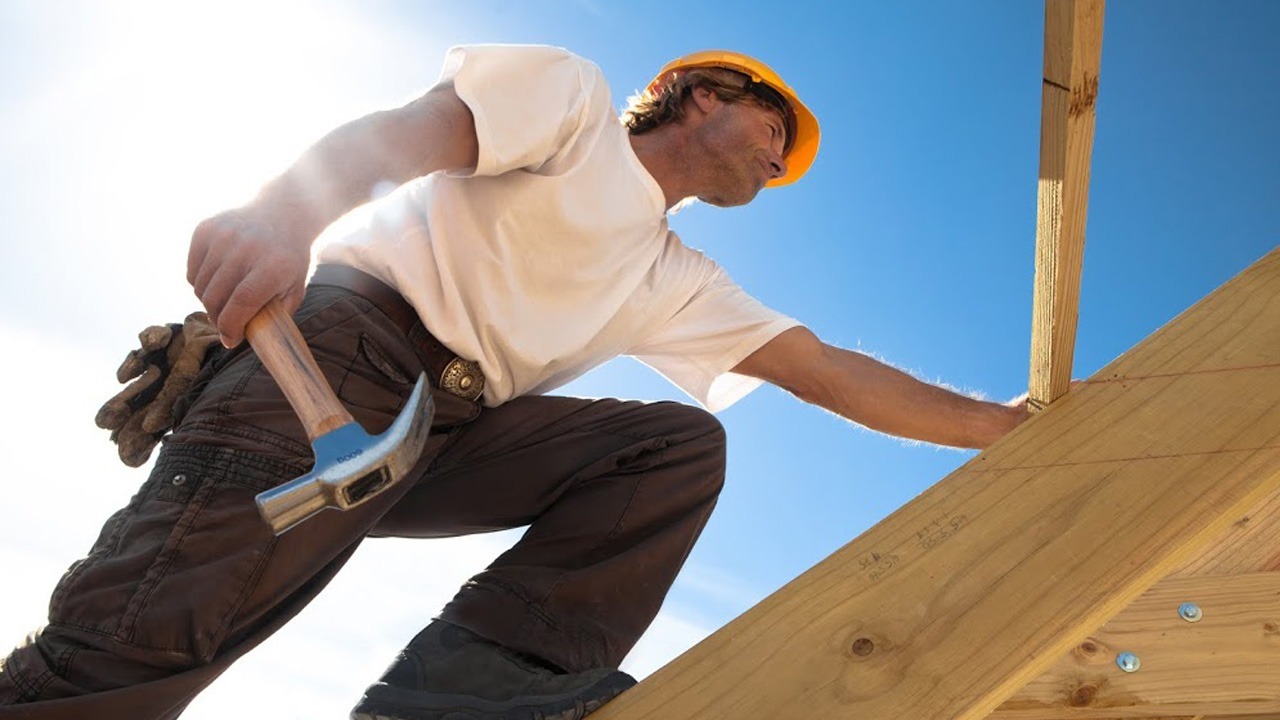 <img src="roofer.jpg" alt="man building roof structure">