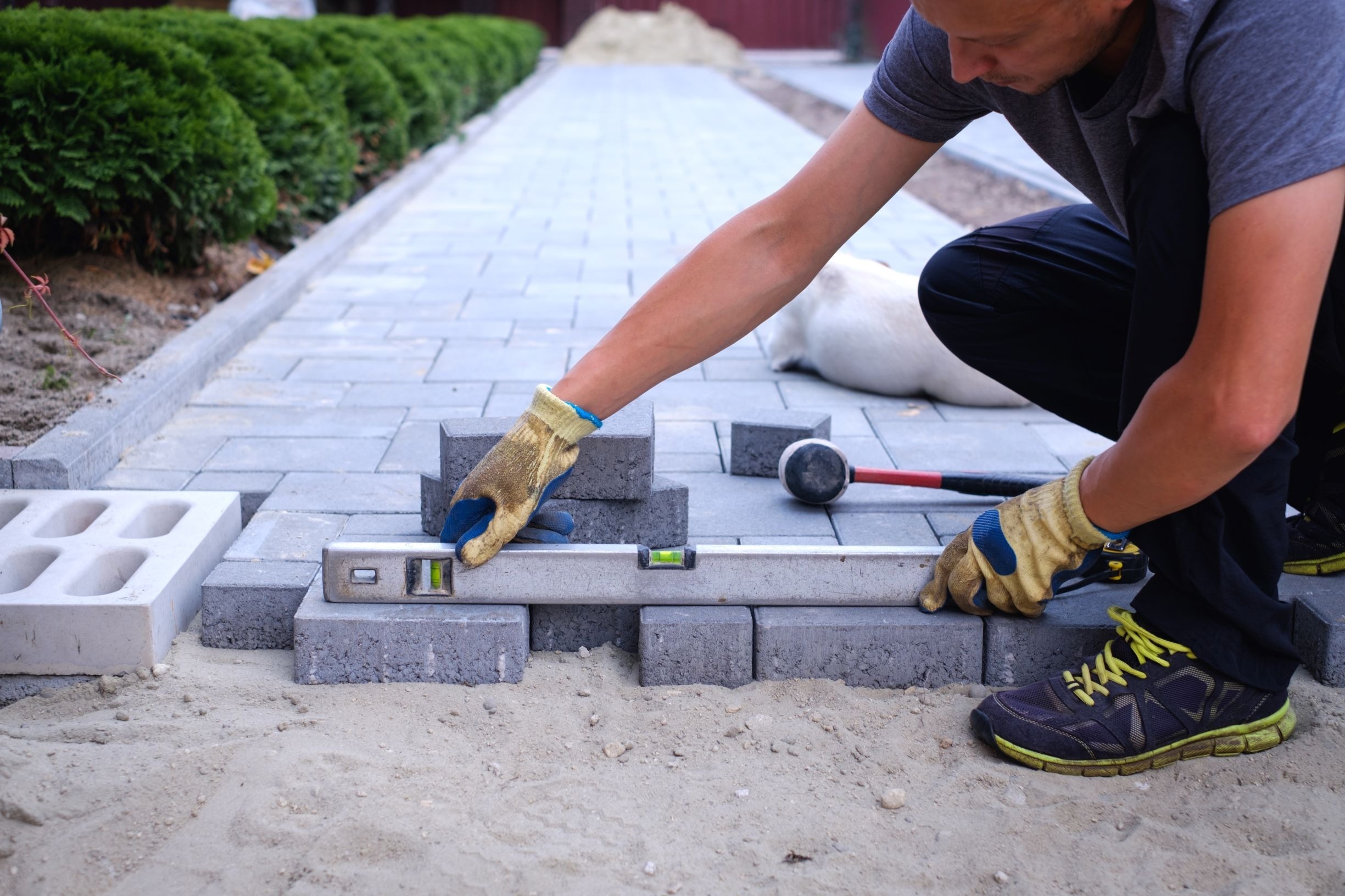 <img src="walkway.jpg" alt="man building walkway">