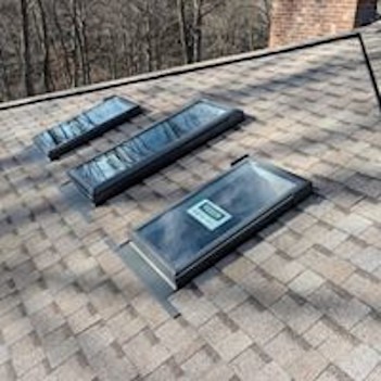 <img src="skylights.jpg" alt="three shylights on roof">