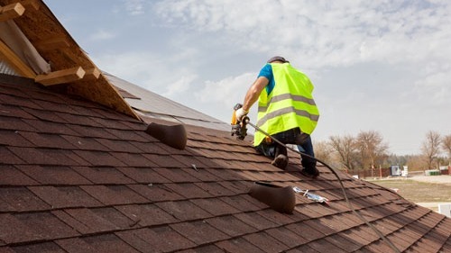 <img src="ecommercial roof.jpg" alt="man putting on commercial roof">