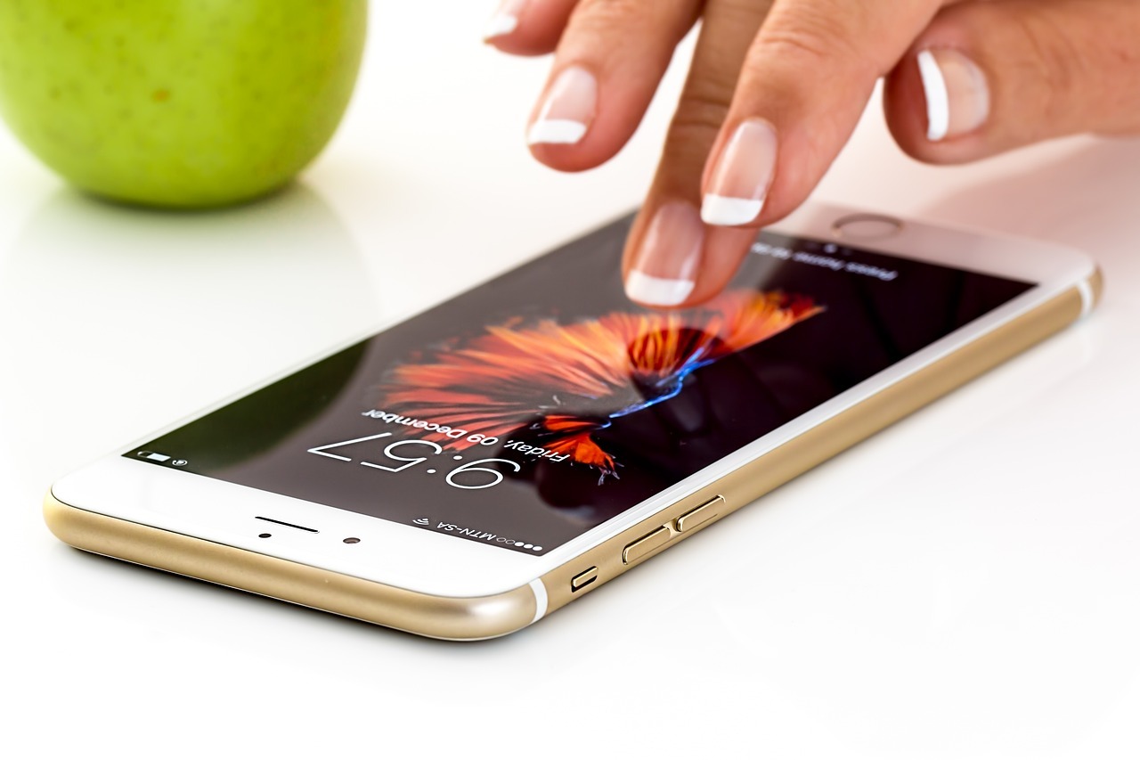 Hand scrolling on a phone searching online