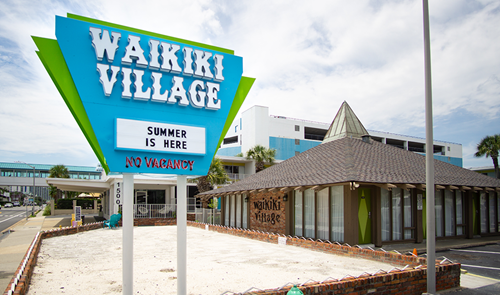 Waikiki Village sign in Myrtle Beach near affordable workforce housing.
